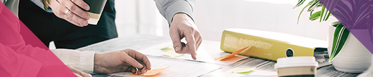 Group of people collaborating on a work desk