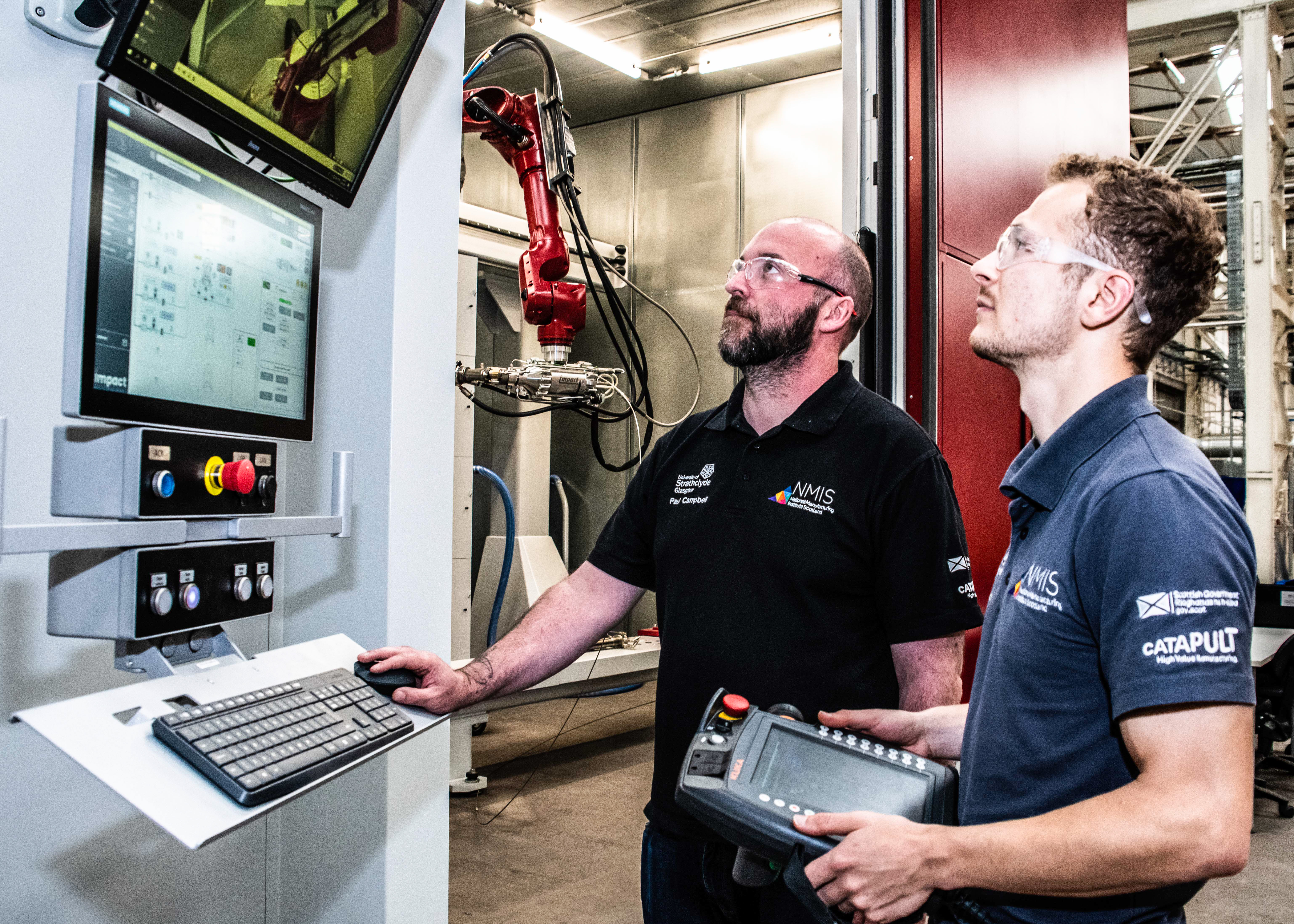 2 men operating a screen and machine