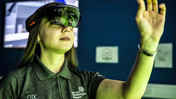 Female engineer using virtual reality headset