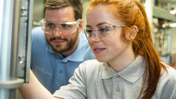 Female engineer working with male colleague